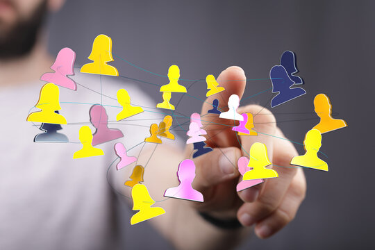 Hand touching digital network of people symbolizing social connections, teamwork, community, and communication. A modern concept showcasing huma