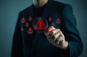 professional touching a digital warning icon on a futuristic interface, symbolizing cybersecurity risk alerts, system errors, data threats, and critical safety notifications in modern technology.