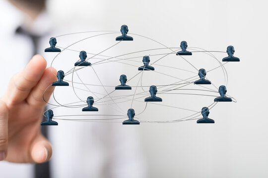 Hand holding digital network of people connected by lines. Concept of teamwork, social connection, and communication, collaboration, working tog