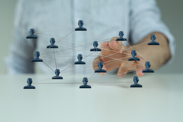 Abstract design of a network with person icons. Illustrative of teamwork, connection, and social media concepts.