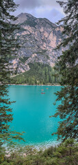 A beautiful view of Lake Braies, Italy, South Tyrol. The mountain lake with crystal clear, cold water on an overcast day.