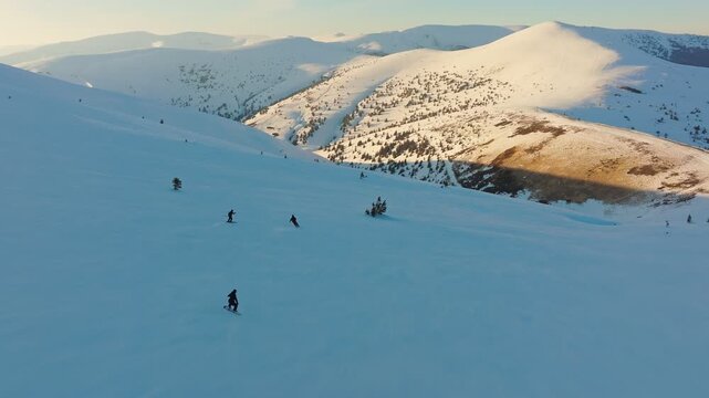 Snowcovered ridgelines illuminated by warm sunset light during winter skiing, Vibrant winter landscape featuring enthusiastic skiers carving across snowdusted mountains at dusk