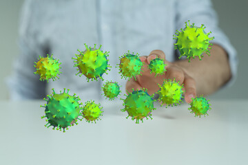Concept of health and pandemic with a hand interacting with digital virus particles illustration. Representing
