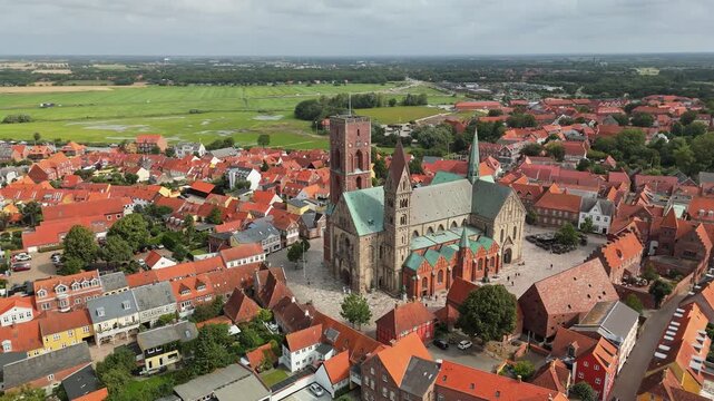Aerial shot of charming streets and historic landmarks of Ribe, Denmark. Flying around Ribe Cathedral in Ribe old town, Denmark 