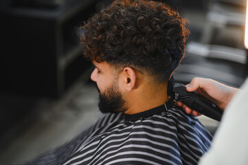 Man getting modern fade haircut at barbershop