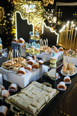 Graduation celebration buffet offering desserts, cupcakes and savory snacks