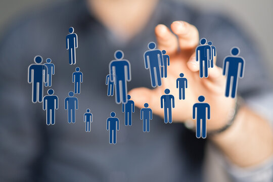 Abstract image showing human figures and hand representing digital teamwork and human resources. Business and t - Powered by Adobe
