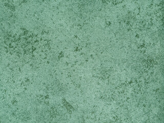 Obraz premium Decorative jade green washed paint on a surface. Random limestone green color washed paint with grunge, and dirt pattern. Seamless background texture. 