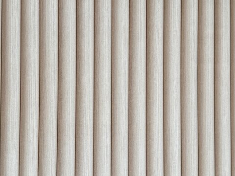 Natural light white oak wood fluted panel or fluted strips, rustic wood. Seamless background texture.