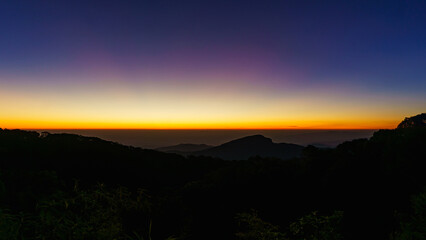 Beautiful green mountain landscape of colorful sunrise shining over Doi Inthanon at Mae Jam, Chiang Mai, Thailand.