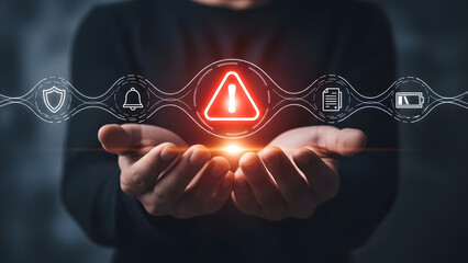 Hands holding glowing digital warning triangle network
