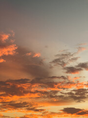 Fototapeta premium Dramatic Sunset Clouds in Orange and Gray Sky