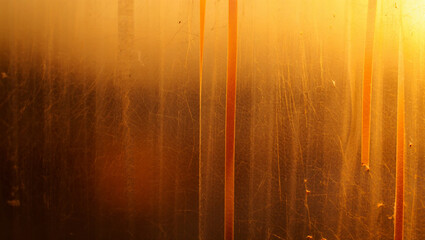 Abstract golden textured background with vertical orange lines and scratches image