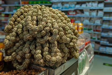 Authentic regional specialty &mdash;  Hainan&rsquo;s traditional partridge tea (wrapped tea balls) sold in everyday grocery stores. Chinese tea culture, local markets and culinary tourism.