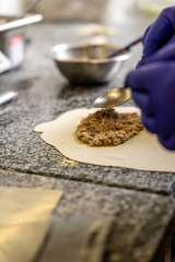 Halal tatar cheburek preparation with meat filling