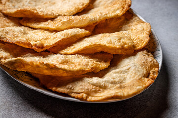 Plate of crispy halal tatar chebureks stacked together