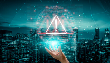 A captivating scene showing a human hand reaching for a warning icon symbolizing digital security. The background features a cityscape at night filled with data elements. Gantry