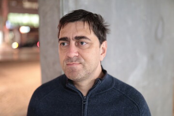 Mature man looking away in thoughtful contemplation