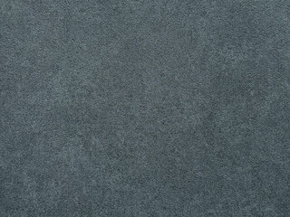 Decorative dark blue grey washed paint on a surface. Random limestone dark blue color washed paint with gold grunge, and dirt pattern. Seamless background texture.      