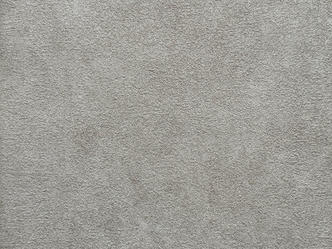 Close up of concrete washed cement texture with brush stroke, grunge, and dirt pattern. Suitable for wall and floor finishes. Seamless background texture.