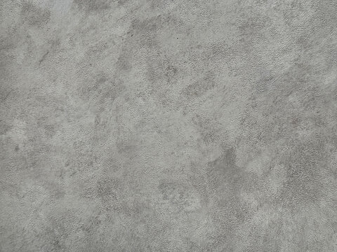 Close up of concrete washed cement texture with brush stroke, grunge, and dirt pattern. Suitable for wall and floor finishes. Seamless background texture.