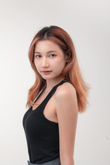 Confident beautiful asian woman red hair and healthy facial and body skin on white background for cosmetology concept.