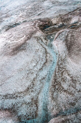 Glacier texture in shades of blue, turquoise, gray, and white. Design and wallpapers.