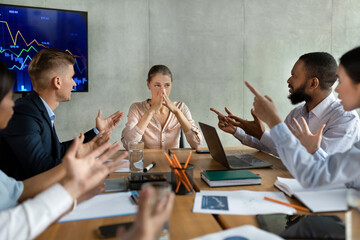 In a corporate meeting, aggressive coworkers are loudly confronting a female colleague over a...