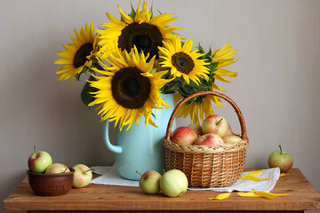 Sunflowers in pitcher with apples still life harvest