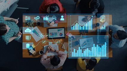 A diverse group of professionals engages in a collaborative business meeting, utilizing data analysis and digital tools to enhance strategies and drive growth. Trope