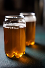 Two cold amber craft beer cans