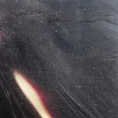 A dark, organic-style abstract surface with flowing light streaks and soft gradients, created using 3D rendering techniques. Ideal for backgrounds, digital art, and graphic design projects.