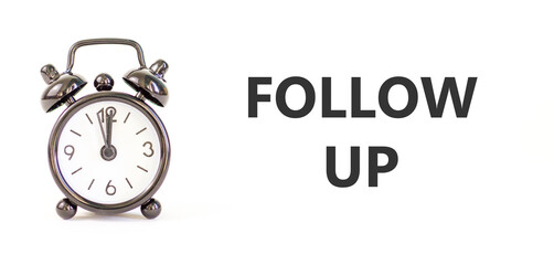 Follow up symbol. Concept word Follow up on beautiful white paper. Beautiful black alarm clock. Beautiful white paper background. Business follow up concept. Copy space.