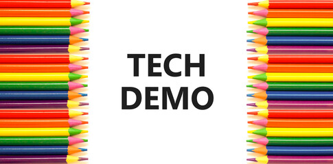 Tech demo symbol. Concept word Tech demo on beautiful white paper. Colored pencils. Beautiful white...
