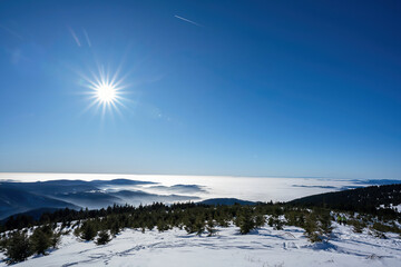 Beautiful sunny weather on snowy mountains