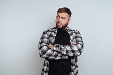 Man in Plaid Shirt Looking to the Side