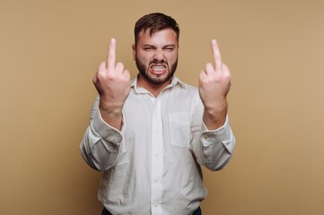 Man in white shirt making rude gestures with both hands.