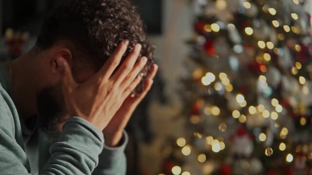 Sad and lonely man feeling depressed during the christmas holiday