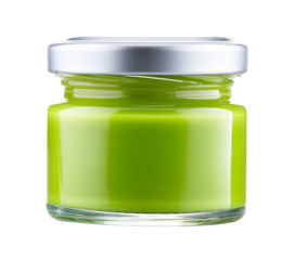 A glass jar with a thick, light green paste with a glossy texture on a transparent background