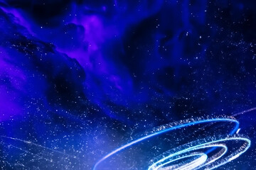 Abstract swirling blue and purple cosmic nebula with glowing light trails and sparkling particles creating a sense of wonder and mystery in deep space