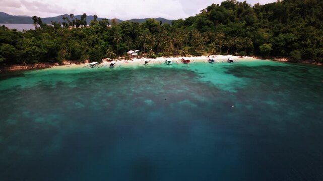 Beautiful tropical island with white sand and beaches surrounded by crystal clear blue water in Palawan, Philippines, South East Asia