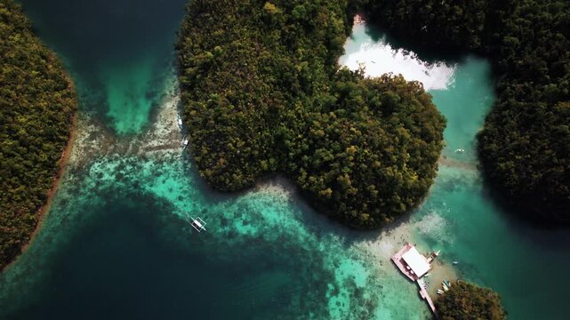 Beautiful tropical island with white sand and beaches surrounded by crystal clear blue water in Palawan, Philippines, South East Asia