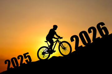 A silhouette of a cyclist riding towards the future, marked by the years 2025 and 2026, against a golden sunset