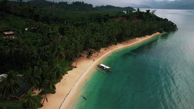 Beautiful tropical island with white sand and beaches surrounded by crystal clear blue water in Palawan, Philippines, South East Asia