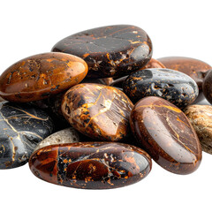 A close-up photograph of a polished pile of brown and black jasper worry stones against a solid black background.