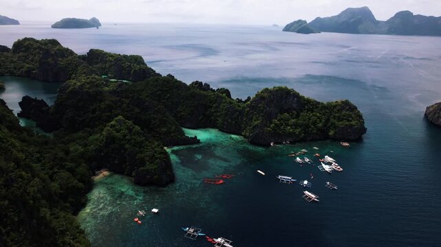 Beautiful Big Lagoon with kayaks surrounded by crystal clear blue water in Palawan, Philippines, South East Asia