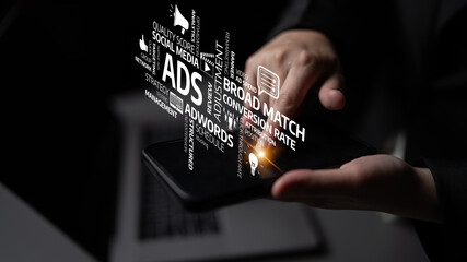A modern representation of digital marketing concepts on a smartphone, showcasing keywords related to ads, social media, and management in a professional environment. Tessel