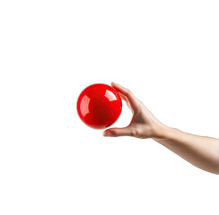 Hand delicately holds a glossy, spherical red object against a black backdrop