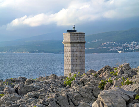 Stone lighthouse on the coast in Silo on Krk Island Croatia