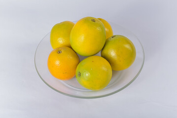 Fresh Brazilian oranges on a clean, minimalist table